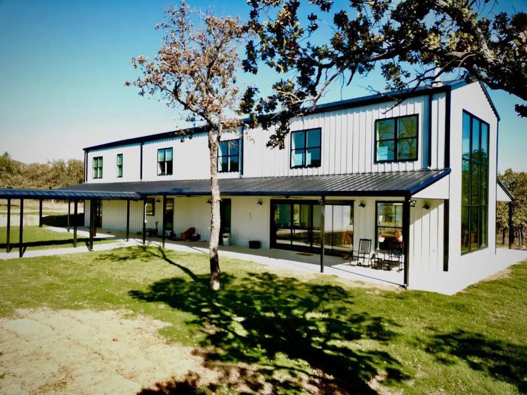 Tall modern black and charcoal barndominium