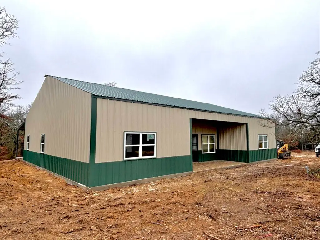 green and tan barndominium
