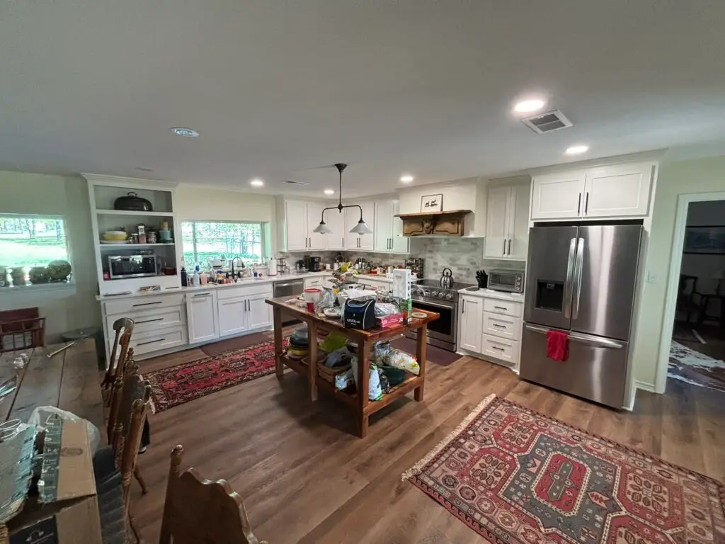 kitchen with wooden floors and white cabinets