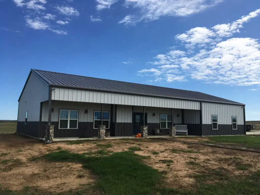 dark gray and cream barndominium with large pretty porch