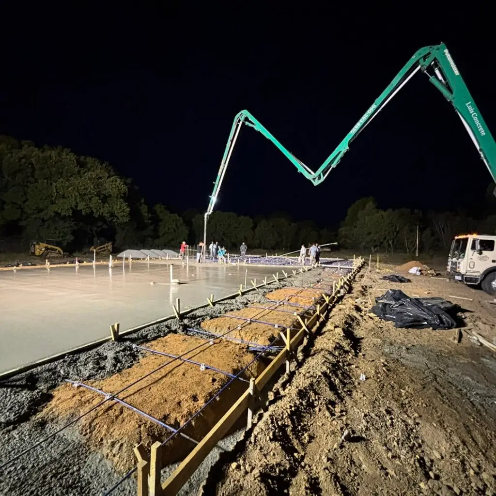 machines pouring concrete in the early morning